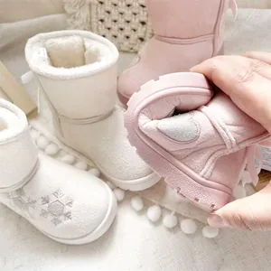 Detail view showing the soft and flexible sole of cute girls' embroidered winter snow boots