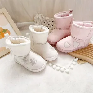 Warm girls embroidered fleece-lined snow boots with snowflake and heart design patterns.