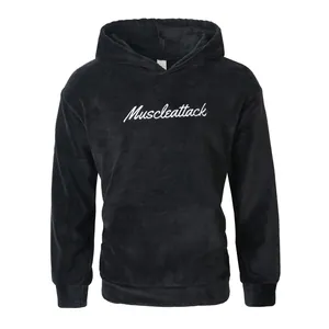 Full front view of black plush fleece hoodie with white Muscleattack script embroidery