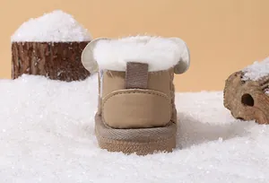 Back view of baby winter snow boots with warm white faux fur lining and soft sole