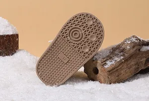 Detailed macro view of non-slip rubber sole for infant winter snow boots size 17