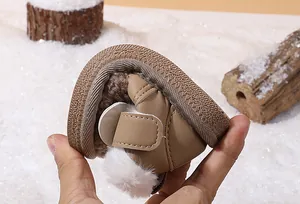 Detail view of flexible soft sole on plush winter baby snow boots for walkers