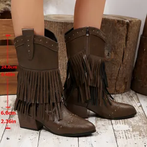Detailed view of brown fringe cowboy boots with 6cm heel and 24cm shaft measurements