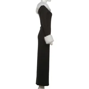 Gedetailleerd zijaanzicht van een elegante zwarte lange jurk met wit imitatiebont