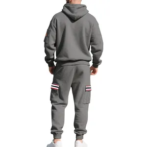 Back view of a men's heavy fleece grey tracksuit set featuring cargo pockets and stripes