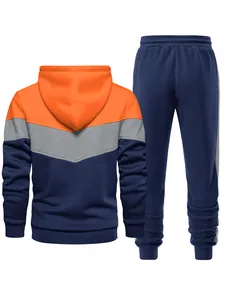Detailed back view of men's color-block tracksuit with orange, grey and navy blue hoodie