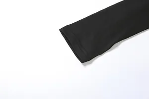 Detail view showing double-stitched sleeve cuff on women's black slim-fit jumpsuit