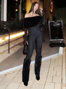 Sexy off-the-shoulder jumpsuit with faux fur trim and matching leg warmers in black