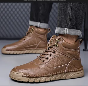 Detailed view of brown genuine leather men's Martin boots on model with high-top design.