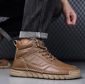 Detail view of brown pebbled leather men's high-top Martens boots with rugged rubber sole