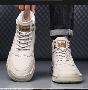 Detail view of men's beige leather high-top boots with textured stitching and sturdy sole.
