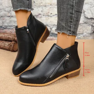 Detail of black women's block heel ankle boots with double side zippers and measurements.