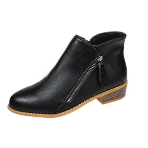 Side view of women's black faux leather ankle boots with chunky heel and dual zippers