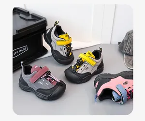 Detailed shot of children's multi-color outdoor sports sneakers with durable rubber soles