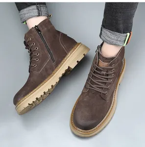 Detailed macro view of men's brown suede Martin boots featuring a functional side zipper