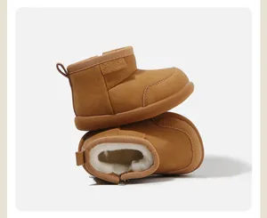 Baby snow boots featuring warm fleece lining and solid camel brown suede finish