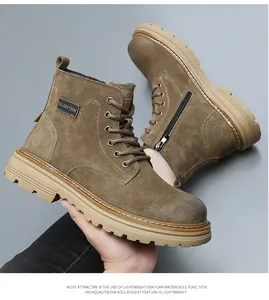 Detail view of brown suede men's work boots featuring a side zipper and thick sole