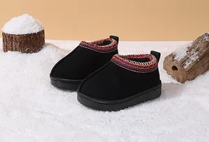 Detailed view of warm toddler snow boots presented in a cozy winter snow scene