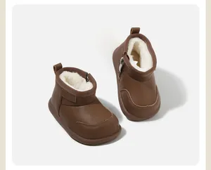 Cozy brown baby snow boots with thick white faux fur lining for winter warmth.