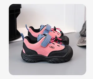 Close-up side view of pink and blue kids' sports sneakers with durable rubber soles