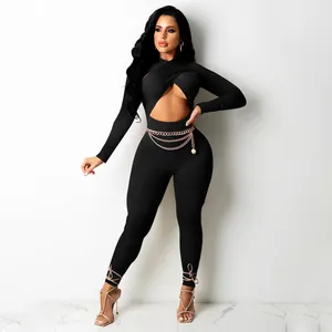 Detailed view of black sexy cross cutout long sleeve jumpsuit with chain belt decoration