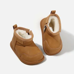 Classic brown toddler snow boots featuring warm faux fur lining and side zipper closure