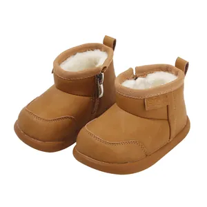 Warm brown baby snow boots with cozy faux fur lining and side zipper details