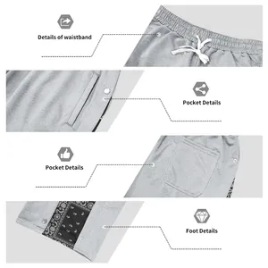 Detailed view of men's paisley snap button pants showing waistband and pockets.