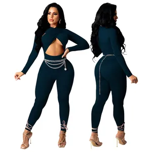 Front and back view of a sexy dark teal cutout jumpsuit with crisscross waist design