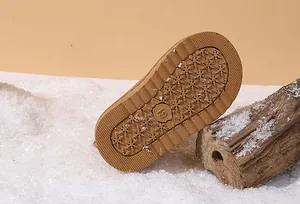Detail of anti-slip rubber sole for toddler snow boots with snowflake pattern in size 19
