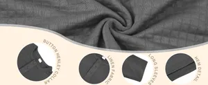 Close-up detail of grey jacquard texture long-sleeved Henley shirt showing fabric and collar.