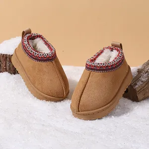 Warm brown suede children's snow boots with faux fur lining and ethnic embroidered trim