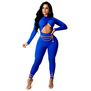 Detail view of royal blue sexy jumpsuit with front cutout and decorative gold waist chain