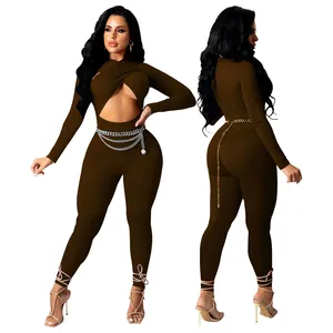 Detailed front and back view of brown long sleeve cutout jumpsuit with chain belt