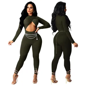 Front and back view of sexy olive green cross front long sleeve jumpsuit with chain