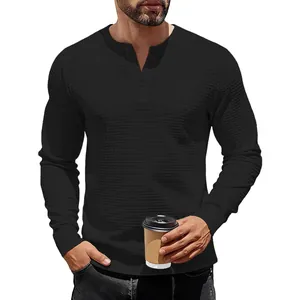 Men's heavy waffle knit Henley shirt in black with long sleeves and textured fabric