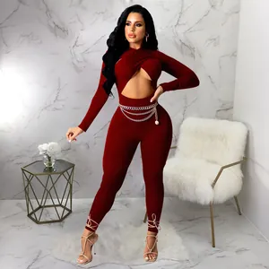 Sexy wine red long sleeve jumpsuit with a deep criss-cross cutout and chic ankle ties.