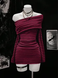 Detail of gothic long sleeve off-shoulder top with pink and black horizontal stripes