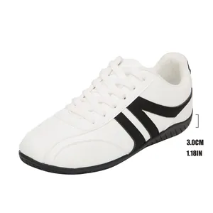 Macro view showing the 3.0cm heel height detail of white and black casual sneakers.