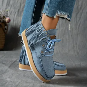 Stylish denim blue fringe ankle boots with blue laces and platform sole in Western style