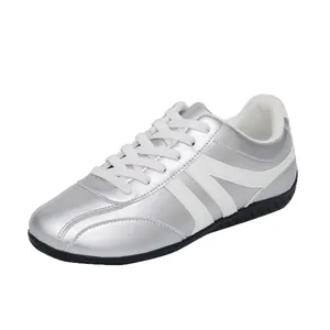 Metallic silver women's casual sneaker with white laces and side stripes
