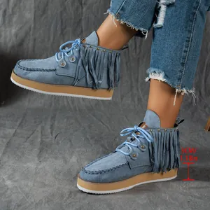 Close-up of blue denim western style tassel ankle boots showing 3cm platform height
