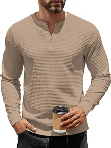 Detailed shot of men's long-sleeve waffle knit Henley shirt in tan color with buttons