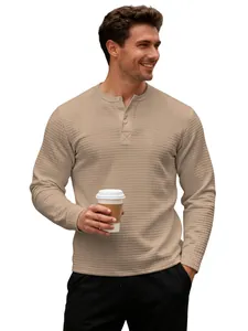 Macro detail view of men's khaki waffle knit Henley shirt showing textured fabric