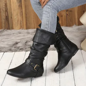 Detailed view of black slouchy tall boots featuring buckle and rivet accents for women