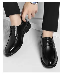 Close-up of men's classic black leather formal shoes with lace-up detail.