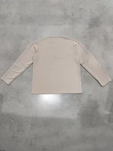 Detailed back view of men's premium beige waffle knit sweatshirt with square jacquard pattern