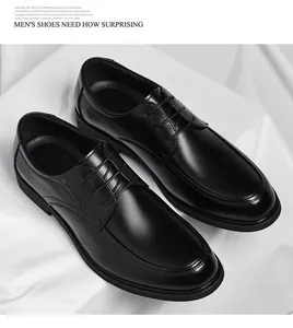 Close-up of black men's formal leather dress shoes on white fabric background