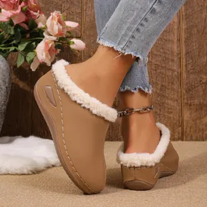 Detailed view of women's wedge platform mules featuring cozy white plush lining and stitching