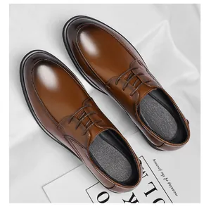 Top-down view of classic brown leather dress shoes for men with elegant lace-up style